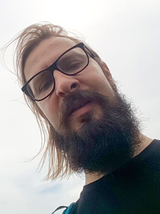 Portrait photo of Adam Flakus